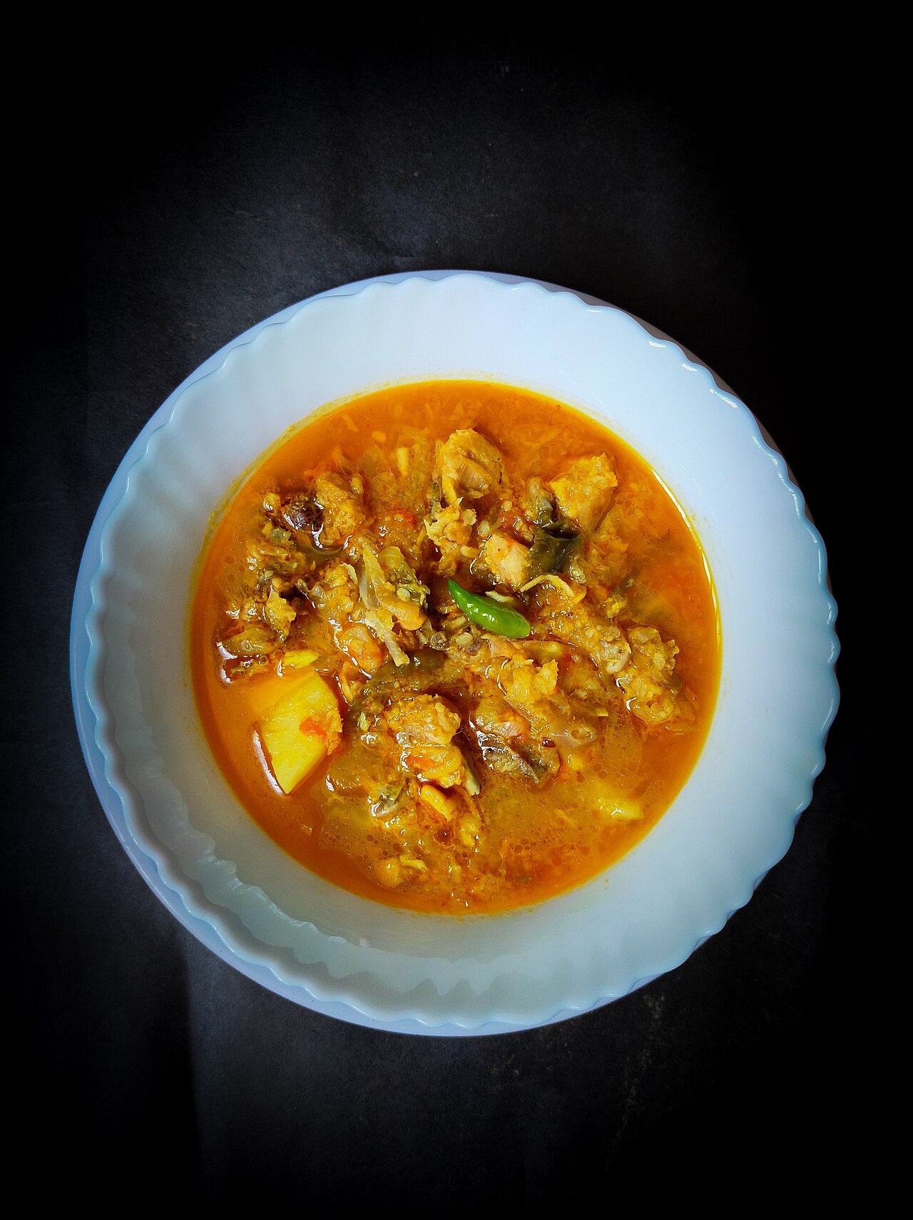 Home-cooked Assamese chicken curry with bamboo shoot