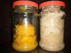 Two jars of homemade bamboo shoot pickle, one with chilli and one without
