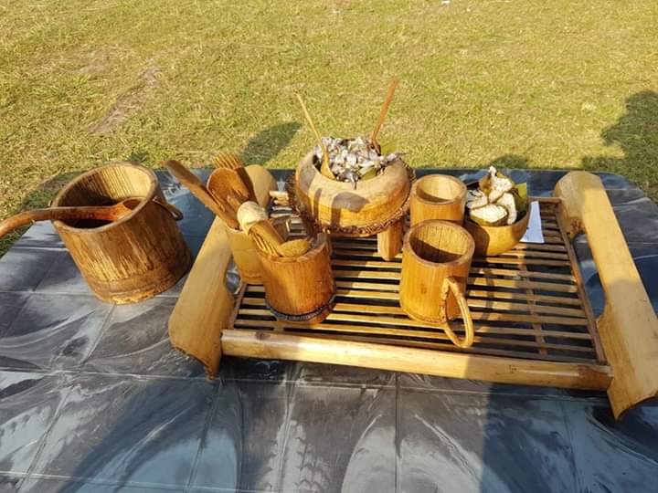 Handmade Garo bamboo jug and mugs set out with food